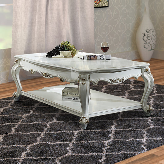 Traditional Style Wooden Coffee Table with Polyresin Carvings and Bottom Shelf, White By Casagear Home
