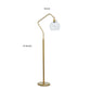 Glass Shade Tilted Metal Frame Floor Lamp, Antique Gold and Clear By Casagear Home