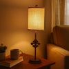 Metal Table Lamp with Cylindrical Drum Shade and Fleur De Lis Accent,Black