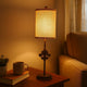 Metal Table Lamp with Cylindrical Drum Shade and Fleur De Lis Accent,Black