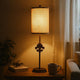 Metal Table Lamp with Cylindrical Drum Shade and Fleur De Lis Accent,Black