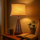 Metal Pyramid Base Table Lamp with Wire Design and Scripted Shade, Gray