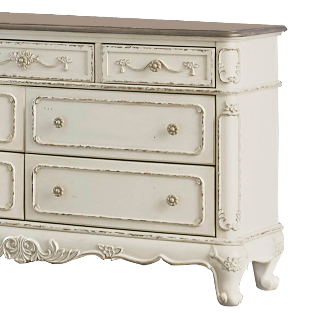 7 Drawer Dresser with Floral Motif Carving Details Antique White and Brown By Casagear Home BM219790