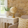 15 Inch Modern Accent Globe, Smooth Turning, White With Gold Aluminum Stand By Casagear Home