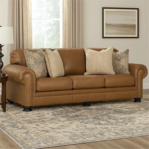 Ashley Riana 101" Sofa, 4 Accent Pillows, Caramel Brown Leather