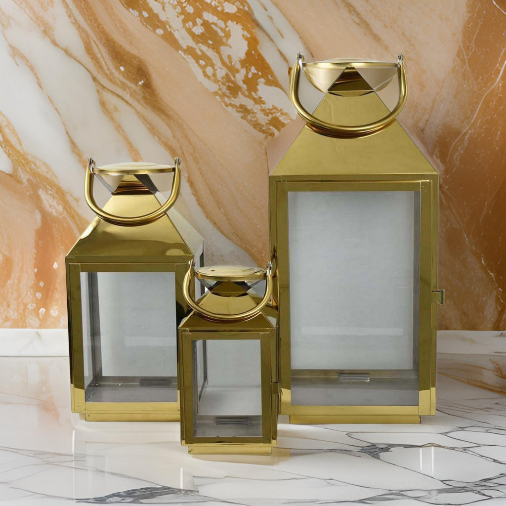 Davi Set of 3 Decorative Lanterns, Curved Handles, Glass Panel, Brass Metal By Casagear Home