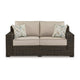 Ashley Waga 71" Outdoor Loveseat, 2 Throw Pillows, Brown, Beige