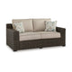 Ashley Waga 71" Outdoor Loveseat, 2 Throw Pillows, Brown, Beige