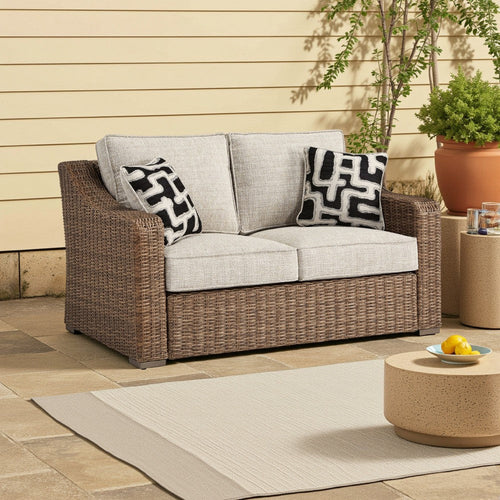 Ashley Tira Outdoor Loveseat, 57 Inch Handwoven Resin Wicker, Beige, Pillows