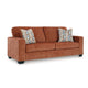 Ashley Avie Sofa, 2 Accent Pillows, 85 Inch, Soft Burnt Orange Polyester