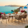 Ashley Yami Outdoor Dining Table, 80 Inch Oval Faux White Stone Top, Brown