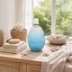 Ethan Decorative Bottle w Lid | Gold Metal Details | Blue-White Glass 15"