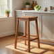 Heno Outdoor Bar Height Stool | Saddle Seat | Honey Brown Eucalyptus Wood