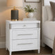 Ruvie Nightst& with 3 Drawers | Metal Post Accent | White Wood 26"