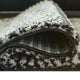 Mera Geometric Medium Area Rug | Black and Ivory Polypropylene Frieze 5x7