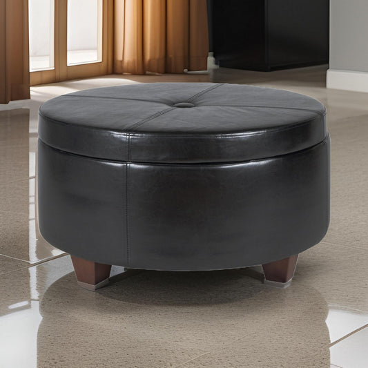 Leatherette Single Button Tufted Round Ottoman with Wooden Feet, Large, Black and Brown - K5508-E676 By Casagear Home