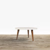 24" Modern Coffee Table, Round Off White MDF Top, Tapered Brown Mango Wood Legs By The Urban Port
