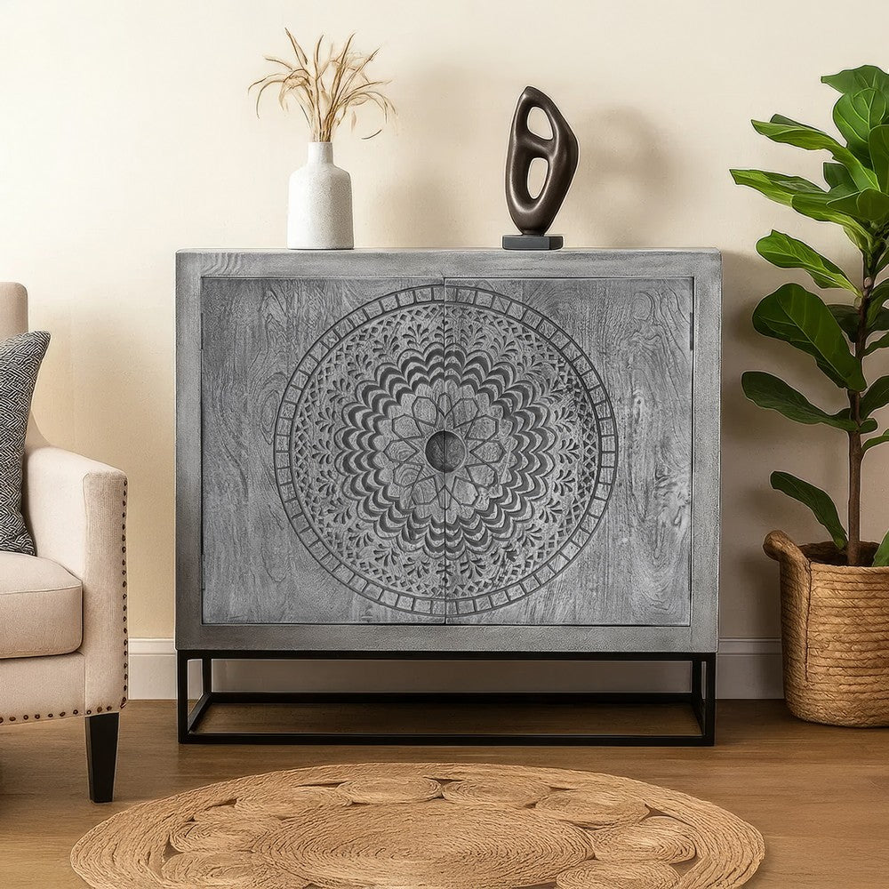 Zera 39 Inch Accent Cabinet with 2 Doors, Hand Carved Medallion, Sandblasted Gray Mango Wood, Black Iron Frame By The Urban Port