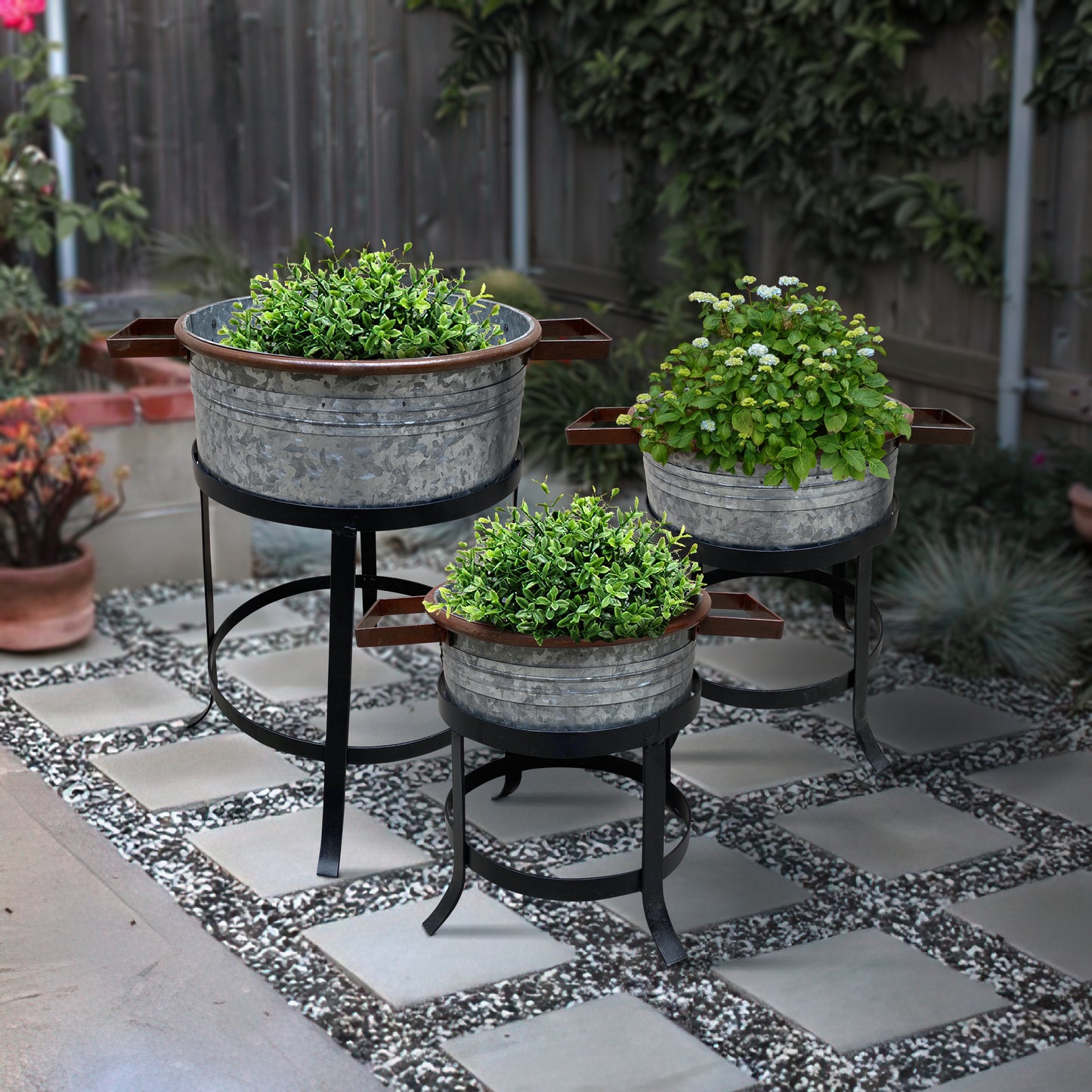 21, 18, and 16 Inch 3 Piece Round Tub Metal Planter Set with Stand in Galvanized Gray and Black Iron By The Urban Port