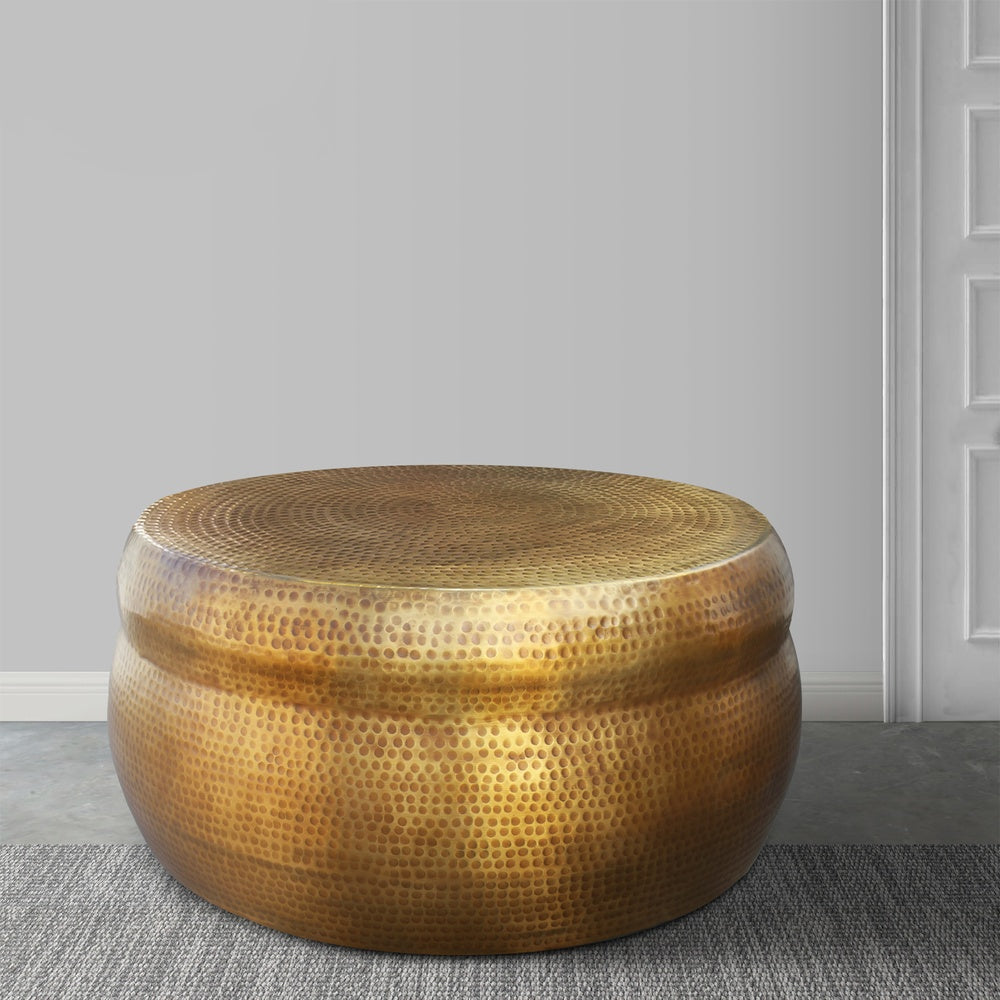 32 Inch Artisanal Round Drum Coffee Table, Hammered Embossed Texturing, Aluminum, Antique Brass By The Urban Port
