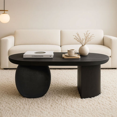 Uri 38 Inch Oval Coffee Table, Mango Wood Full and Half Spherical Leg, Sandblasted Black The Urban Port