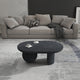 Uri 38 Inch Oval Coffee Table, Mango Wood Full and Half Spherical Leg, Sandblasted Black The Urban Port