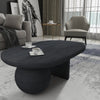 Uri 38 Inch Oval Coffee Table, Mango Wood Full and Half Spherical Leg, Sandblasted Black The Urban Port