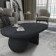 Uri 38 Inch Oval Coffee Table, Mango Wood Full and Half Spherical Leg, Sandblasted Black The Urban Port