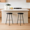 Elira 24" Backless Counter Stool with Round Mango Wood Seat | Black Iron Legs | Gold Footrest By The Urban Port