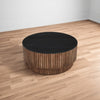 Montoya Coffee Table | 34" Round Black Top | Brown Mango Wood Fluted Plinth Base By The Urban Port