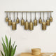 Neyra Iron Cow Bells Wall Decor 48 Inch Wide Decorative, Antique Gold Finish, Jute Hanging Rope By The Urban Port