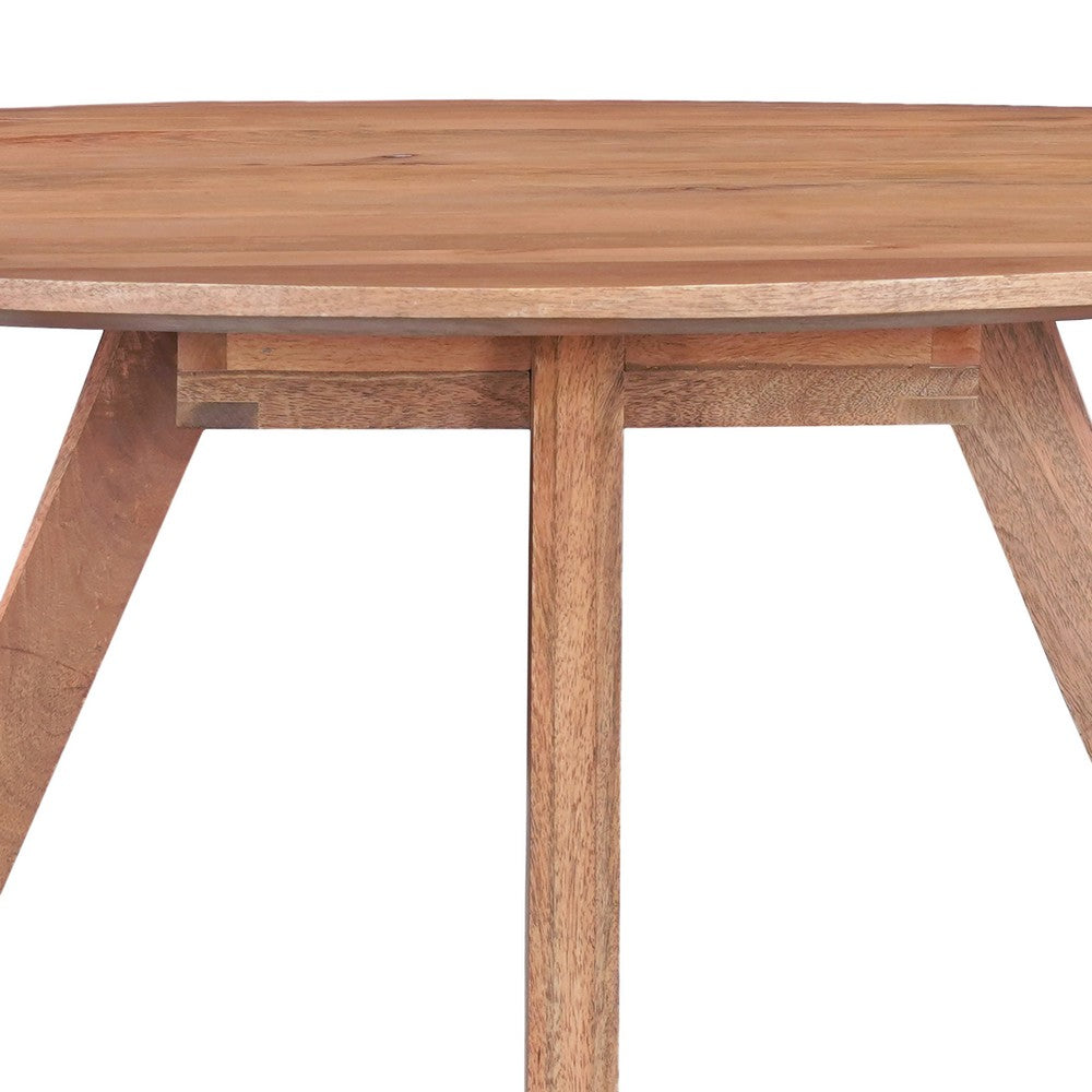 Temi Dining Table | 47" Round Top | Handmade Natural Brown Mango Wood | Angled Four Legged Base By The Urban Port