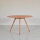 Temi Dining Table | 47" Round Top | Handmade Natural Brown Mango Wood | Angled Four Legged Base By The Urban Port