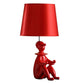 Fabric Shade Table Lamp with Polyresin Sitting Clown Base, Red By Casagear Home