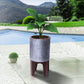 Farmhouse Plant Stand with Ribbed Design and Wooden Legs, Antique Silver and Brown By The Urban Port