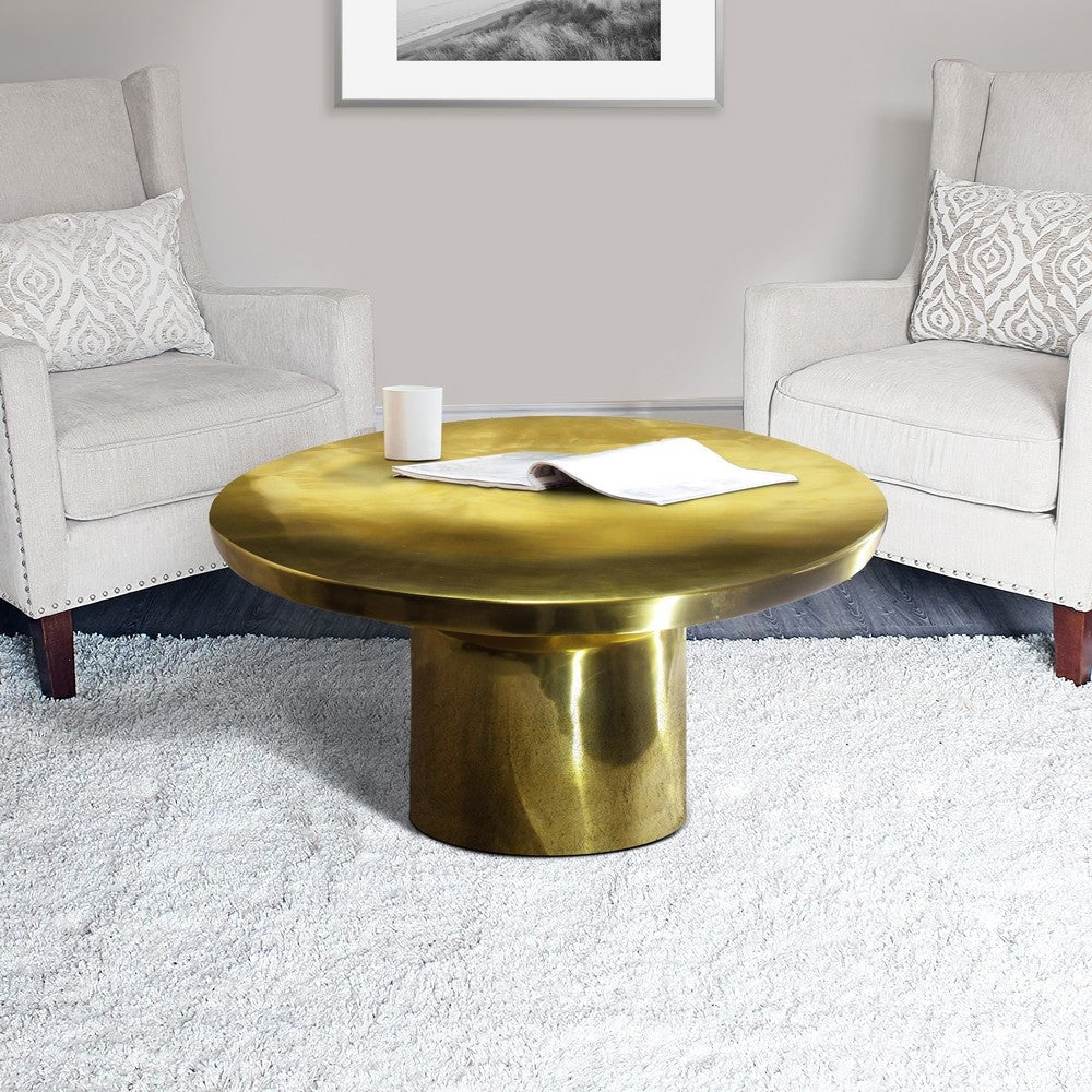 Zoe 30 Inch Modern Classic Round Metal Coffee Table with Pedestal Base, Glossy Gold Brass By The Urban Port